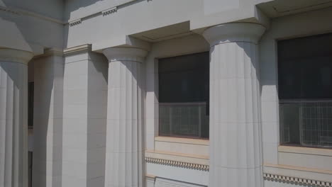 backward dolly shot of the barricaded windows of the georgia courthouse