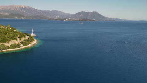 Ionian Sea aerial in Greece: two-masted ship motors between islands
