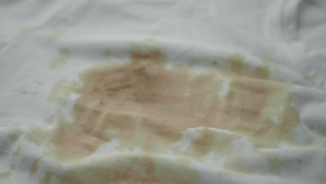 a white shirt with a coffee stain.