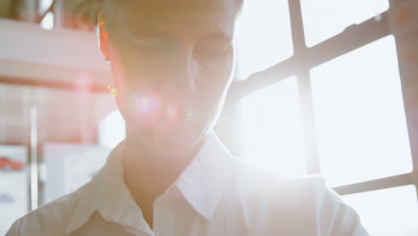 female executive using smartwatch in office 4k