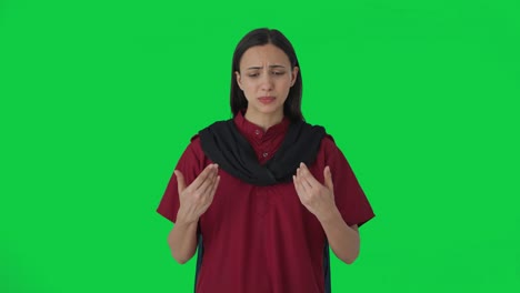 Indian-female-hotel-staff-talking-to-guests-Green-screen