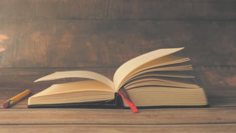 open book on wooden table