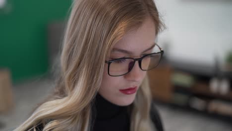 business woman wearing glasses working in office