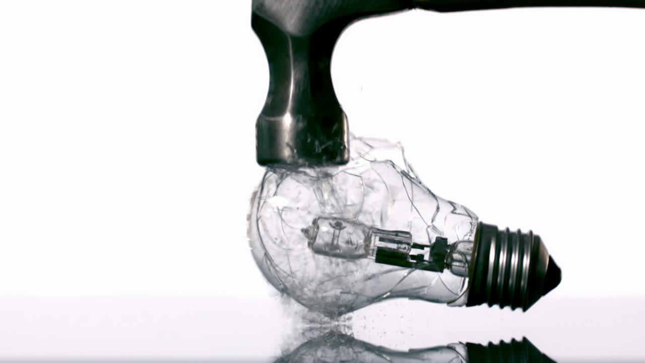 Hammer Smashing Light Bulb On White Background Free Stock Video Footage ...