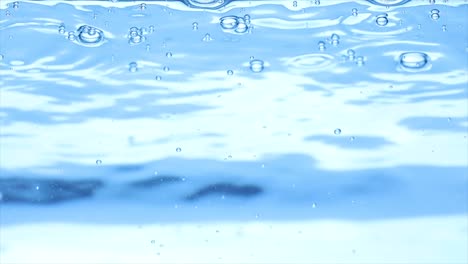 Ice-cubes-falling-under-water-in-slow-motion