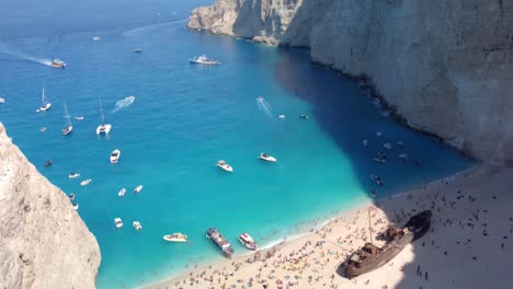 Aerial-panoramic-view-of-the-famous-shipwreck-beach-at-Zakynthos-island,-Ionian-Sea,-Greece,-with-blue-and-turquoise-water
