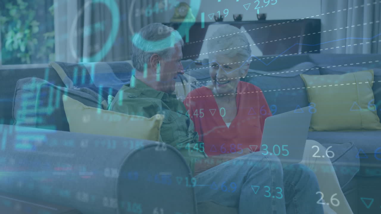 Senior couple reviewing financial charts on laptop in cozy living room, showing floating bar charts