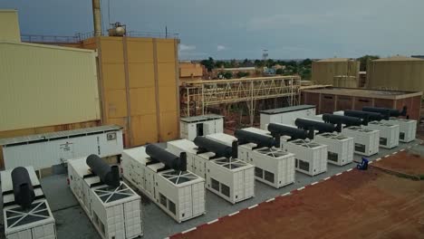 slow rising drone shot of containers power plant in niamey, niger