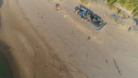 Tourists-Flying-Kites-At-The-Sandy-Beach-In-Noordwijk,-South-Holland,-Netherlands