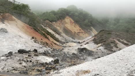 calming scenery of fog moving through mountains, jigokudani, hell valley, still shot, wide shot