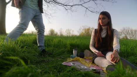 couple having a tarot reading in a park
