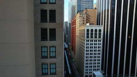 cityscape of chicago l train cutting through downtown city center