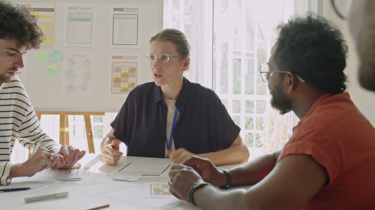 Female Teacher Having Discussion with Multi-Ethnic Students on Lesson