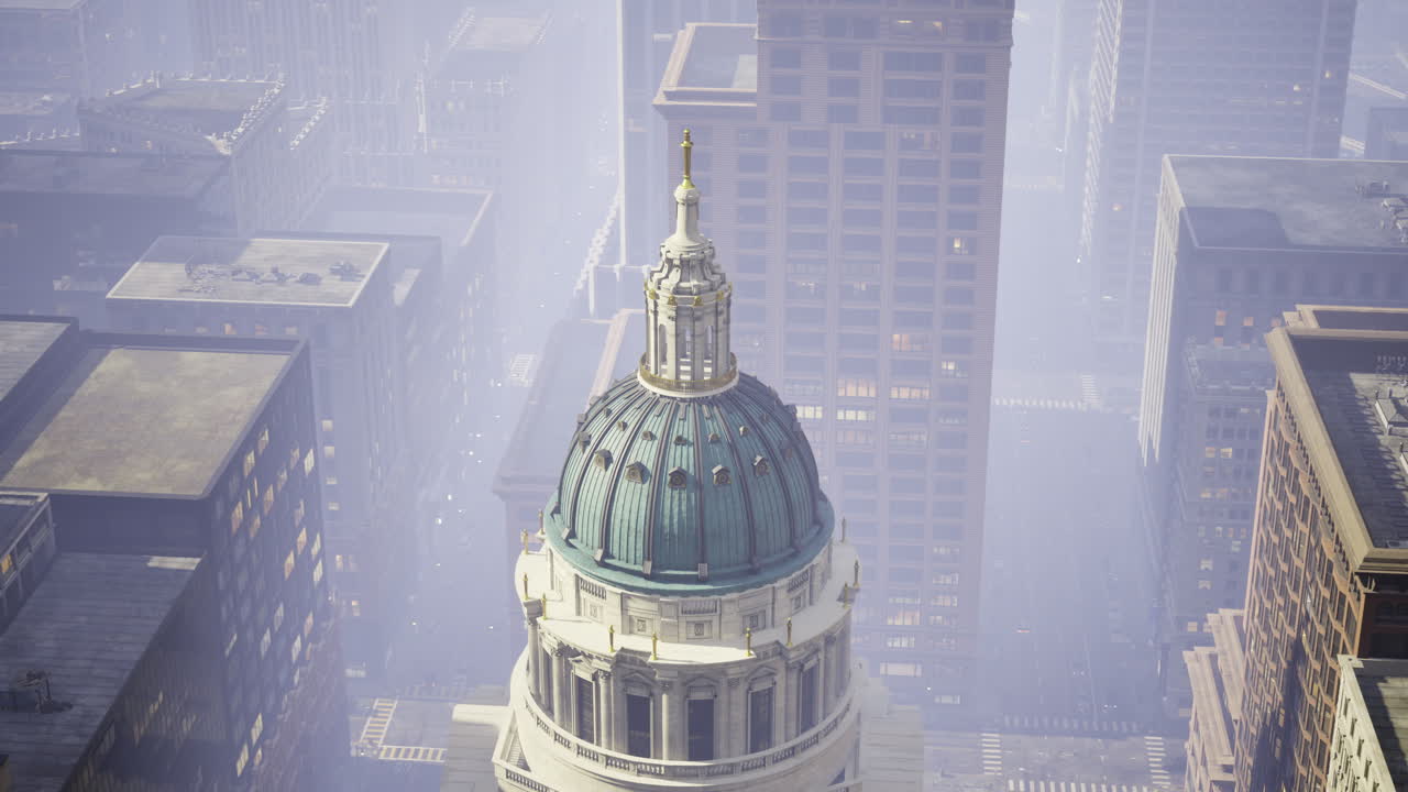 Skyline view of a city with fog enveloping towering buildings and a dome