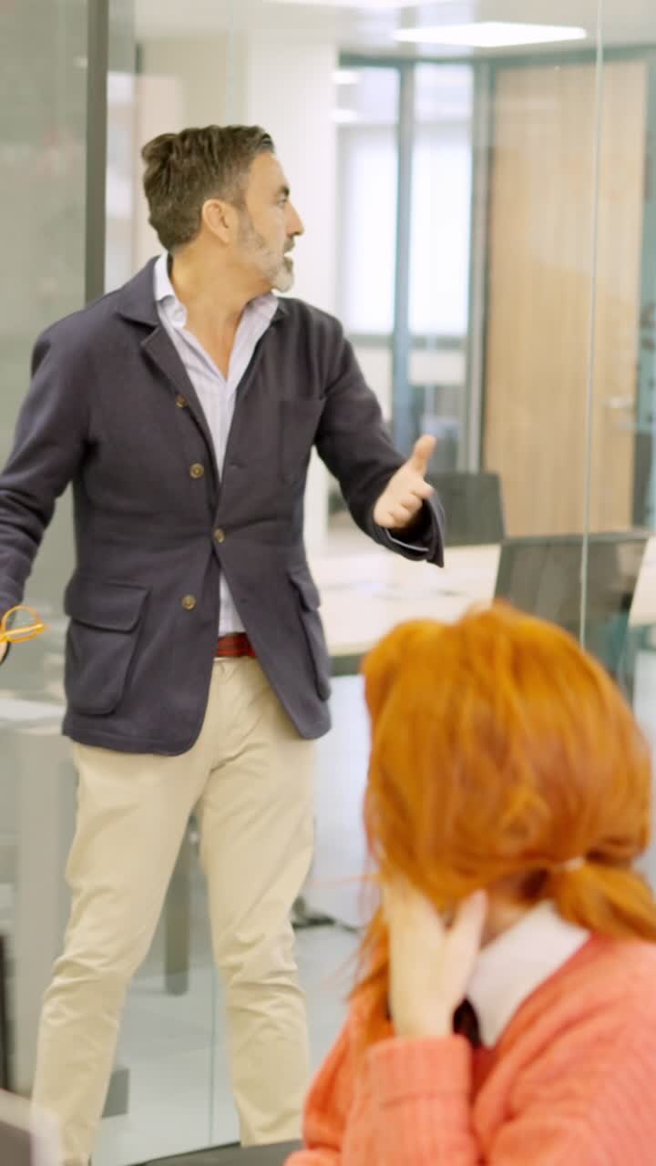 Boss yelling while partner prevents to fire an employee