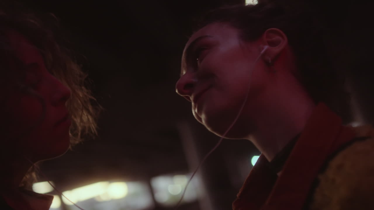 Intimate moment of a couple sharing music