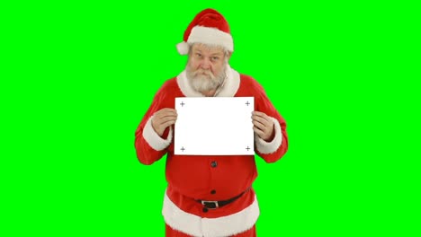 Portrait-of-santa-claus-holding-blank-placard