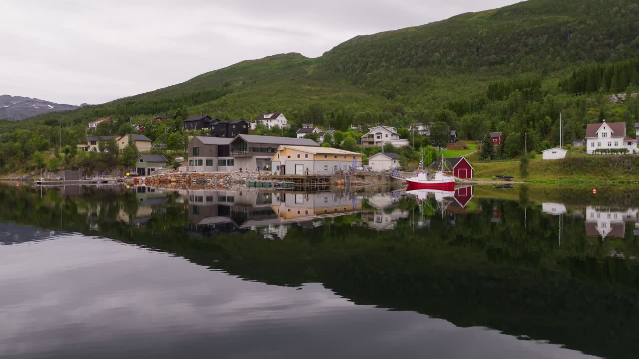 Construction of wooden pier at Tromso, coastal town. Drone view, housing, Norway. Marine