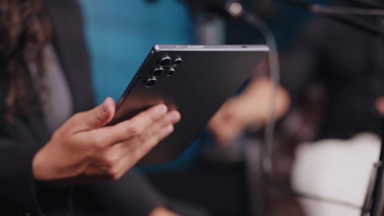Professional Using Tablet in Modern Office Setting