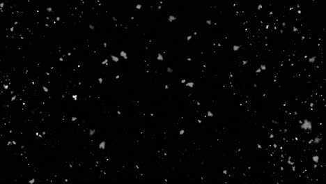 copos de nieve cayendo sobre un fondo negro