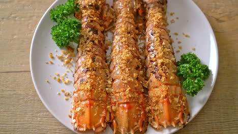 stir fried mantis shrimp with garlic on white plate