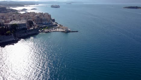 Approaching-Aerial-of-Faliraki-Corfu-City-Old-Town,-Greece