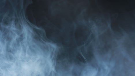 smoke abstract. smoke cloud. smoke on black background in blue light