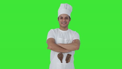 Portrait-of-happy-Indian-professional-chef-Green-screen