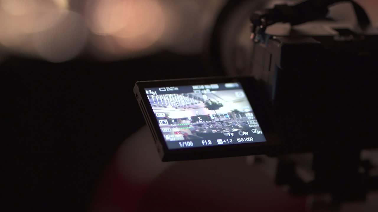 Close-up view about a MILC camera LCD screen with display HUD at an ordinary event, Argentina.