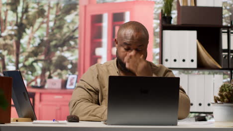 entrepreneur examining accounting data reports on a software at home