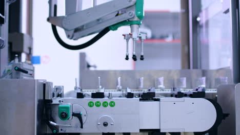 Pharmaceutical-manufacturing-line.-Robot-arm-at-pharmaceutical-plant