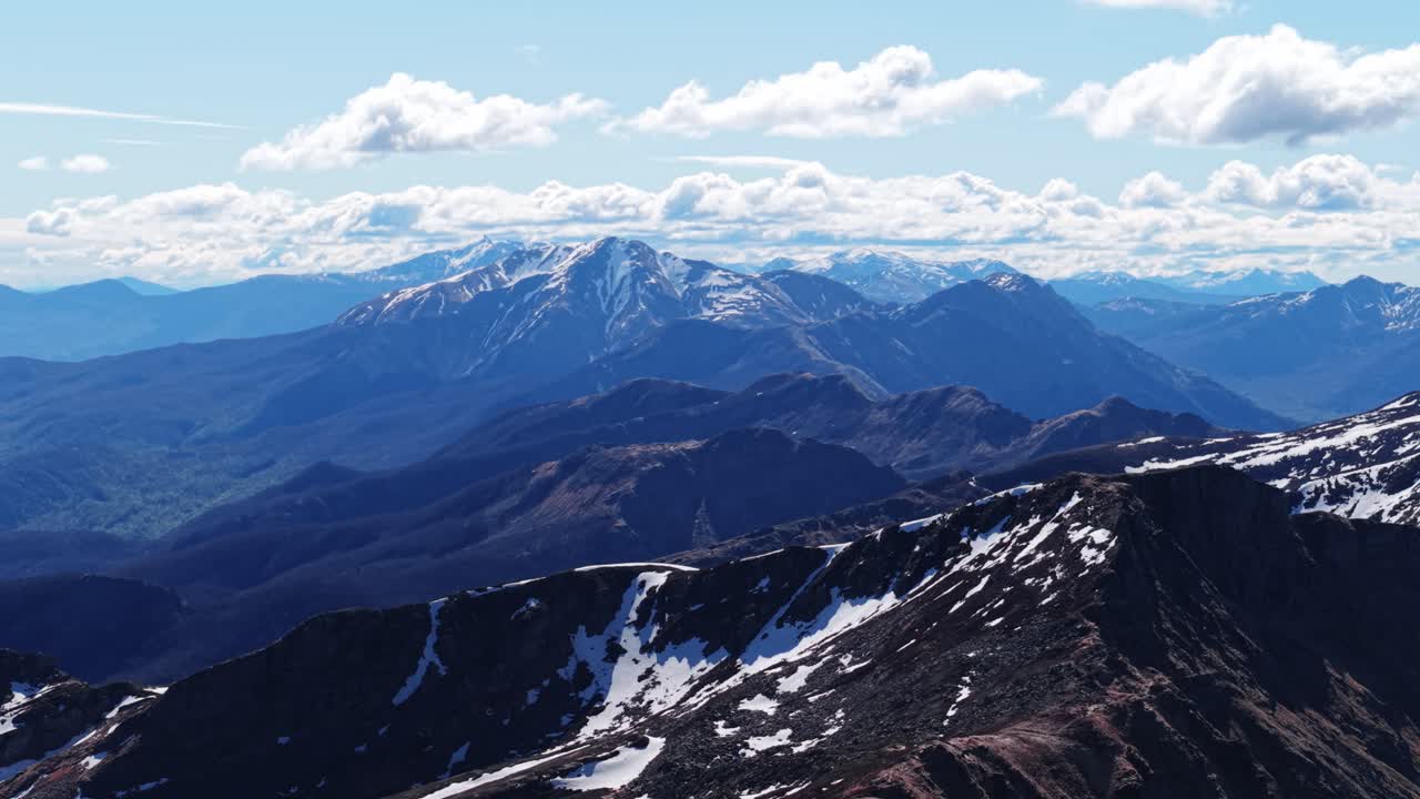 Majestic view of snow-capped peaks in the Dolomites Mountains under a bright sky