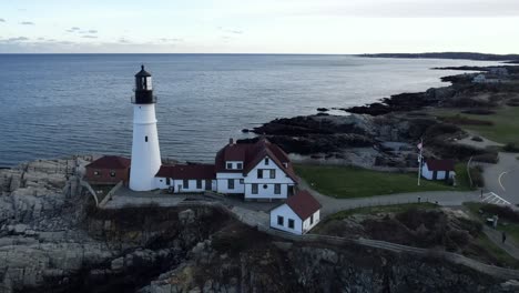 famous landmark of the portland head lighthouse - ascending aerial overlook in maine