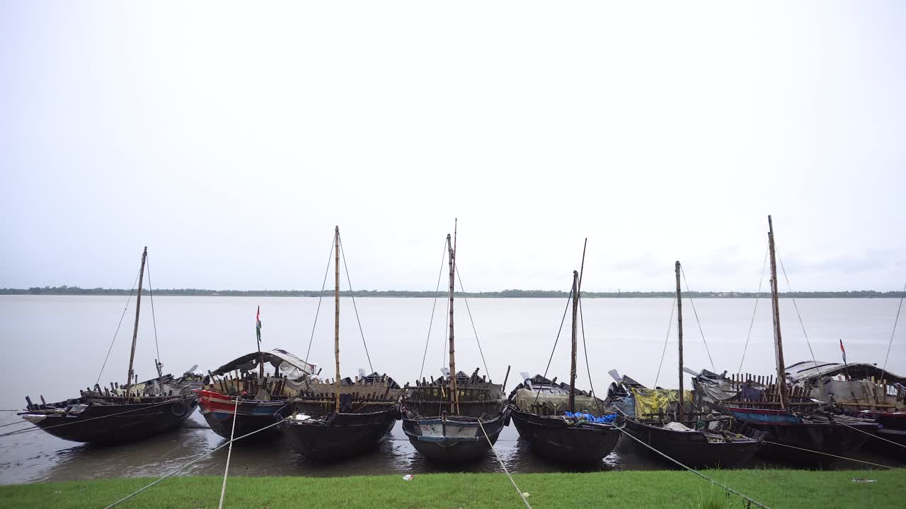 Traditional Boats Moored on a Calm River