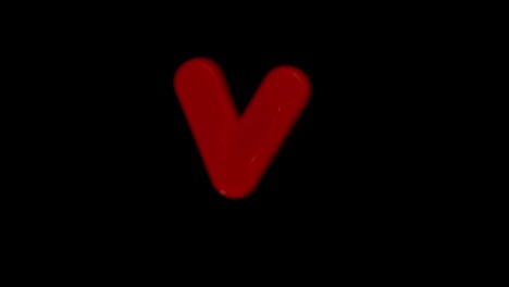 The-letter-v-coming-into-focus-on-black-background