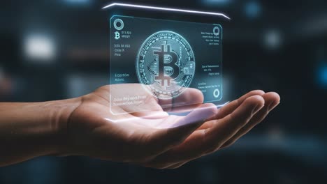 illuminated hand holding a virtual bitcoin display with cryptocurrency information and data overlay in a futuristic digital environment