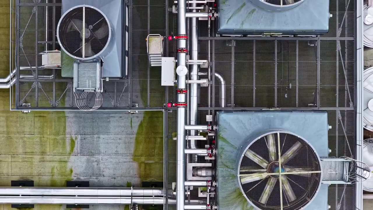 Overhead drone perspective industrial cooling units dirty rooftop copy space