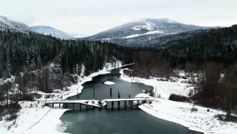 Aerial-View-of-the-Decrepit-Wooden-Bridge-Over-the-Adams-River