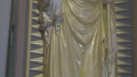 camera movement along a relief of mary with jesus on her arm