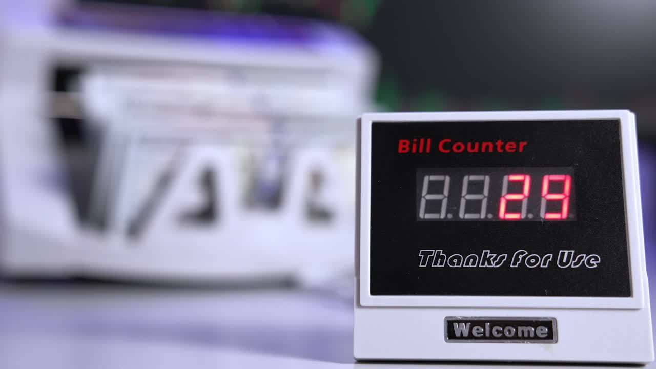 Money counting equipment for paper money calculation. US national paper currency. Automatic mechanism for bank financial operations.