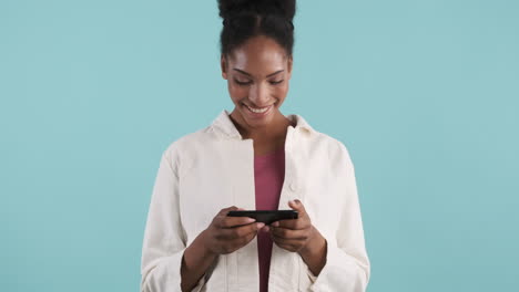 smiling woman watching video on smartphone