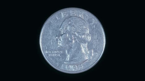 coin toss. quarter dollar flipping in slow motion and shiny in the light. macro