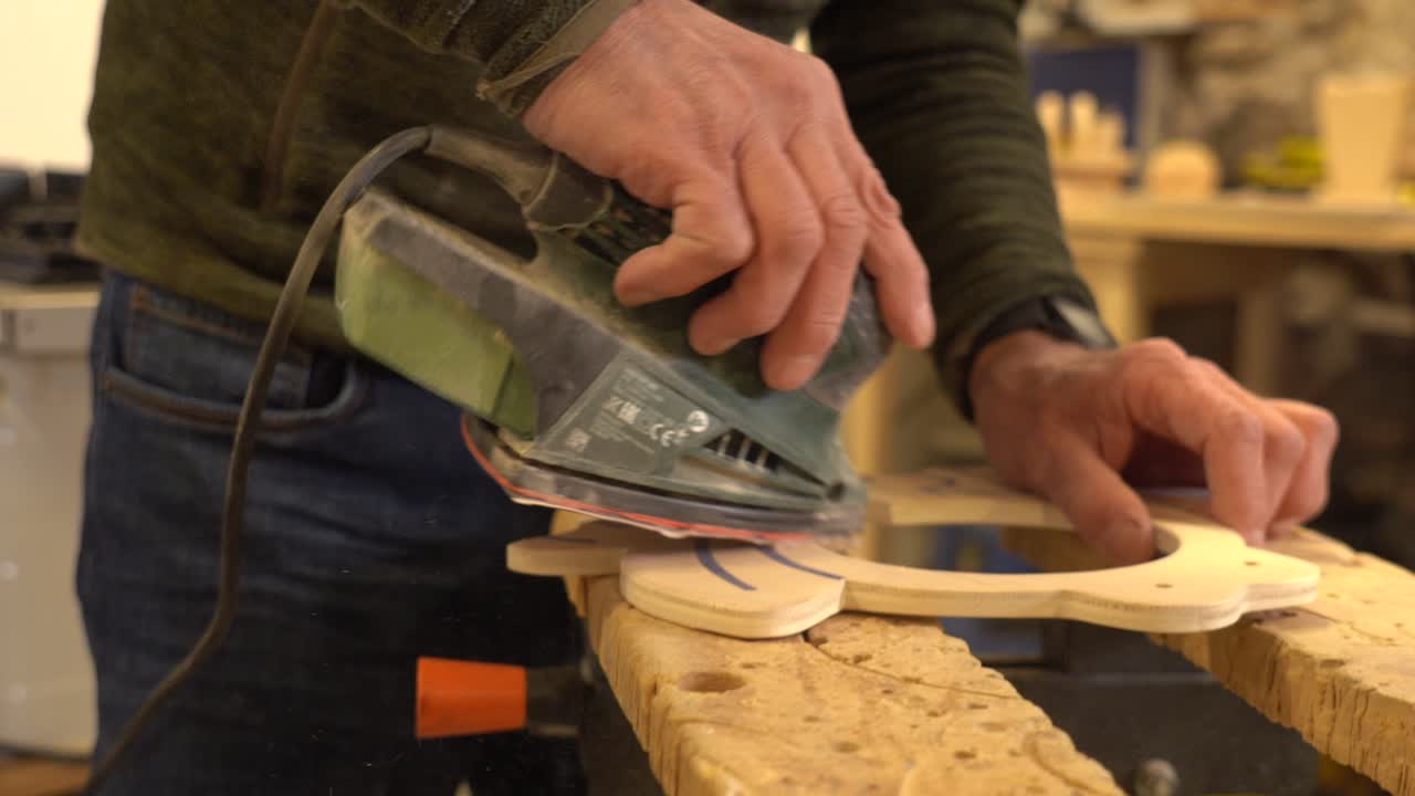 Sanding wood in a workshop