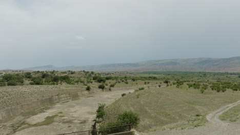 Bridge-and-concrete-dyke-on-shore-of-Dali-Mta-reservoir-in-Georgia