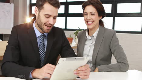 business colleagues using tablet