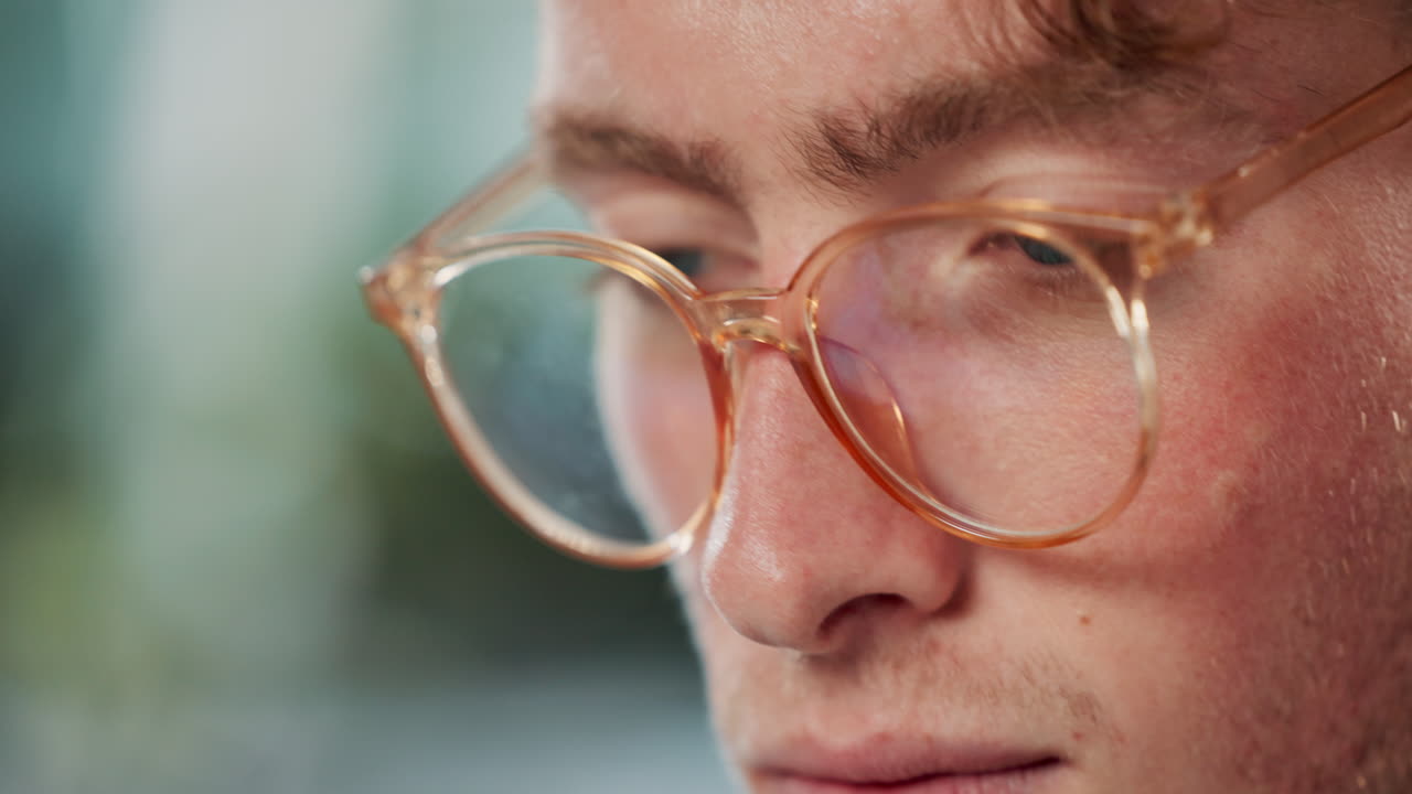 Close-up portrait of a man with glasses