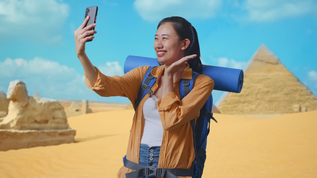 Happy Traveler Taking Selfie in front of Egyptian Pyramids