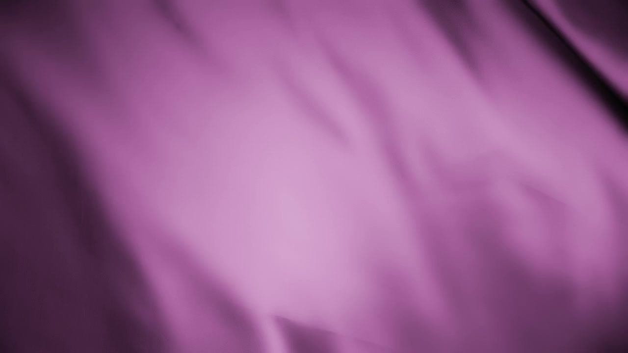 Silky purple fabric waving in the wind. Abstract texture background