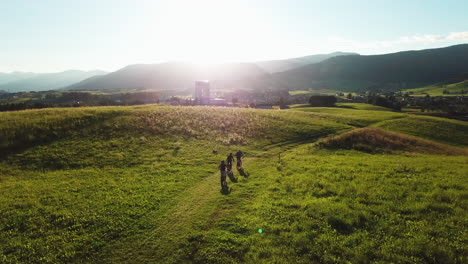 Following-a-group-of-mountain-bikers-riding-on-the-hill-above-green-valley