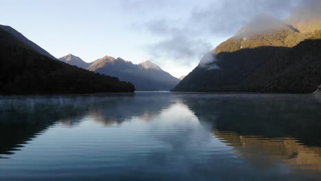 lake and mountains during sunset sunrise 4k drone new zealand